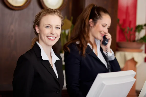 depositphotos_29707639-stock-photo-two-women-working-as-professional.webp